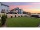 Large backyard with green turf, fence, and hot tub, perfect for outdoor enjoyment and relaxation at 56 Magnolia Ct, Erie, CO 80516