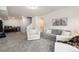 Spacious finished basement with cozy seating, a wet bar, and stairs leading to the upper level at 56 Magnolia Ct, Erie, CO 80516
