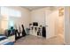 Modern bedroom with a desk, guitars, and a view of the backyard at 56 Magnolia Ct, Erie, CO 80516