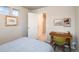 Bedroom featuring warm wood desk, complemented by neutral walls and natural light at 56 Magnolia Ct, Erie, CO 80516