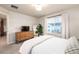 Well-lit bedroom with a neutral color palette and a large window for natural light at 56 Magnolia Ct, Erie, CO 80516