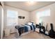 Inviting bedroom with ample natural light, skateboard decor, and space for creativity at 56 Magnolia Ct, Erie, CO 80516