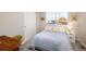 Cozy bedroom with a comfortable bed, neutral decor, and natural light at 56 Magnolia Ct, Erie, CO 80516