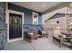 Inviting front porch with comfortable seating and decorative accents, creating a cozy and welcoming entrance at 56 Magnolia Ct, Erie, CO 80516