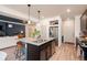 Kitchen with stainless steel appliances, granite countertops, and an open floor plan to the living room at 56 Magnolia Ct, Erie, CO 80516