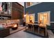 Cozy outdoor patio with a fire pit, sofa, dining table and chairs, creating an inviting space for relaxation at 56 Magnolia Ct, Erie, CO 80516