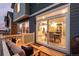 Cozy deck with outdoor seating overlooking the backyard, accessible from the home's open concept dining and kitchen at 56 Magnolia Ct, Erie, CO 80516