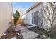 Backyard shows stone pathway from deck to patio with seating at 5664 S Zang St, Littleton, CO 80127