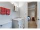 Bright bathroom with a white vanity, toilet, and doorway leading to the bedroom for convenient accessibility at 3161 S Kalispell St, Aurora, CO 80013