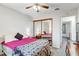 Bedroom with plush carpet, mirrored closet, and ceiling fan at 3161 S Kalispell St, Aurora, CO 80013