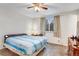 Well-lit bedroom with neutral carpet, a ceiling fan, and a window offering natural light at 3161 S Kalispell St, Aurora, CO 80013