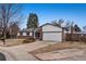 Ranch style home with brick facade, attached garage, and mature landscaping at 3161 S Kalispell St, Aurora, CO 80013