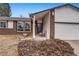 Brick home's front entrance with covered porch and landscaping at 3161 S Kalispell St, Aurora, CO 80013