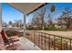 Relaxing front porch with striped chairs overlooking the yard at 3161 S Kalispell St, Aurora, CO 80013