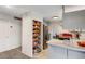 Bright kitchen featuring a pantry with wooden shelves, stainless steel appliances, and modern countertop space at 3161 S Kalispell St, Aurora, CO 80013