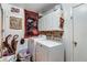 Functional laundry room with washer, dryer, and storage cabinets at 3161 S Kalispell St, Aurora, CO 80013