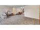 Open concept living and dining area with carpeted floors at 3161 S Kalispell St, Aurora, CO 80013