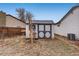 White storage shed in the backyard, providing extra storage at 3161 S Kalispell St, Aurora, CO 80013