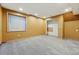 Spacious basement with neutral carpet, recessed lights, and closet space for storage or customization at 3593 S Gibralter Cir, Aurora, CO 80013