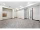 Basement area with open space, neutral carpet, access to bathroom and storage space at 3593 S Gibralter Cir, Aurora, CO 80013