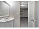 Attached bathroom features a single vanity and opens into a well-lit living space at 3593 S Gibralter Cir, Aurora, CO 80013