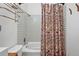 Bright bathroom with colorful shower curtain, decorative tile, and stainless steel fixtures at 3593 S Gibralter Cir, Aurora, CO 80013