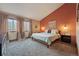 Bright bedroom with large windows, soft carpet, earth-tone walls, and modern decorative touches at 3593 S Gibralter Cir, Aurora, CO 80013