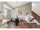 Bright dining area with modern lighting and staircase at 3593 S Gibralter Cir, Aurora, CO 80013