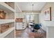 Cozy dining area features hardwood floors, a modern table, and stylish light fixtures at 3593 S Gibralter Cir, Aurora, CO 80013