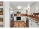 Modern kitchen with stainless steel appliances, granite countertops, and hardwood flooring at 3593 S Gibralter Cir, Aurora, CO 80013