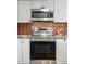 Modern kitchen with stainless steel appliances and ample countertop space at 3593 S Gibralter Cir, Aurora, CO 80013