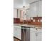Well-lit kitchen with stainless steel appliances, granite countertops, and sink at 3593 S Gibralter Cir, Aurora, CO 80013