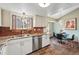 Bright kitchen featuring stainless steel appliances, granite countertops, and a stylish dining area at 3593 S Gibralter Cir, Aurora, CO 80013
