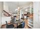 Bright kitchen featuring stainless steel appliances, granite countertops, and a stylish breakfast nook at 3593 S Gibralter Cir, Aurora, CO 80013