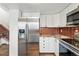 Kitchen with stainless steel appliances, granite countertops, and staircase at 3593 S Gibralter Cir, Aurora, CO 80013