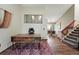 Home office features hardwood floors, a modern desk, and a view into the dining area, providing an open and airy feel at 3593 S Gibralter Cir, Aurora, CO 80013