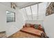Bright sunroom features a skylight, a tile floor, and a relaxing lounging area with decorative accents at 3593 S Gibralter Cir, Aurora, CO 80013