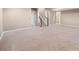 Spacious basement area with neutral carpet, stairs, and ample space for living or recreation at 8099 Sabino Ln, Castle Rock, CO 80108
