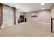 Inviting finished basement with neutral carpet, tv, entertainment center, and comfortable lighting at 8099 Sabino Ln, Castle Rock, CO 80108