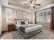 A bedroom featuring a gray bed and stylish decor, complete with windows for natural lighting and light-colored walls at 8099 Sabino Ln, Castle Rock, CO 80108