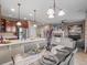 Open-concept dining area flowing into the kitchen and living room, perfect for entertaining and Gathering time at 8099 Sabino Ln, Castle Rock, CO 80108