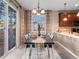 Well-lit dining space with a sliding door to the outdoor deck, stylish décor, and comfortable seating at 8099 Sabino Ln, Castle Rock, CO 80108