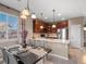 Elegant dining area with stylish decor, chandelier lighting, and a seamless transition to the kitchen at 8099 Sabino Ln, Castle Rock, CO 80108
