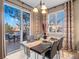 Bright dining area with sliding glass doors to deck and stylish decor with chandelier lighting at 8099 Sabino Ln, Castle Rock, CO 80108