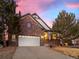 Charming brick home with a two-car garage, mature trees and a welcoming front porch and walkway at 8099 Sabino Ln, Castle Rock, CO 80108