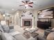 Comfortable living room with brick fireplace, modern decor, and a cozy atmosphere for relaxation at 8099 Sabino Ln, Castle Rock, CO 80108