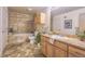 Bathroom with tub and shower combo, and wood vanity offering both style and functionality at 275 S Harrison St # 409, Denver, CO 80209