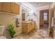 Bathroom with wood cabinets and decorative floor, featuring ample storage and a well-lit vanity at 275 S Harrison St # 409, Denver, CO 80209