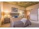 Bedroom with carpet, concrete ceilings, natural light, and night stands on both sides of the bed at 275 S Harrison St # 409, Denver, CO 80209