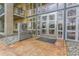 Building entrance featuring steel doors and surrounding windows at 275 S Harrison St # 409, Denver, CO 80209